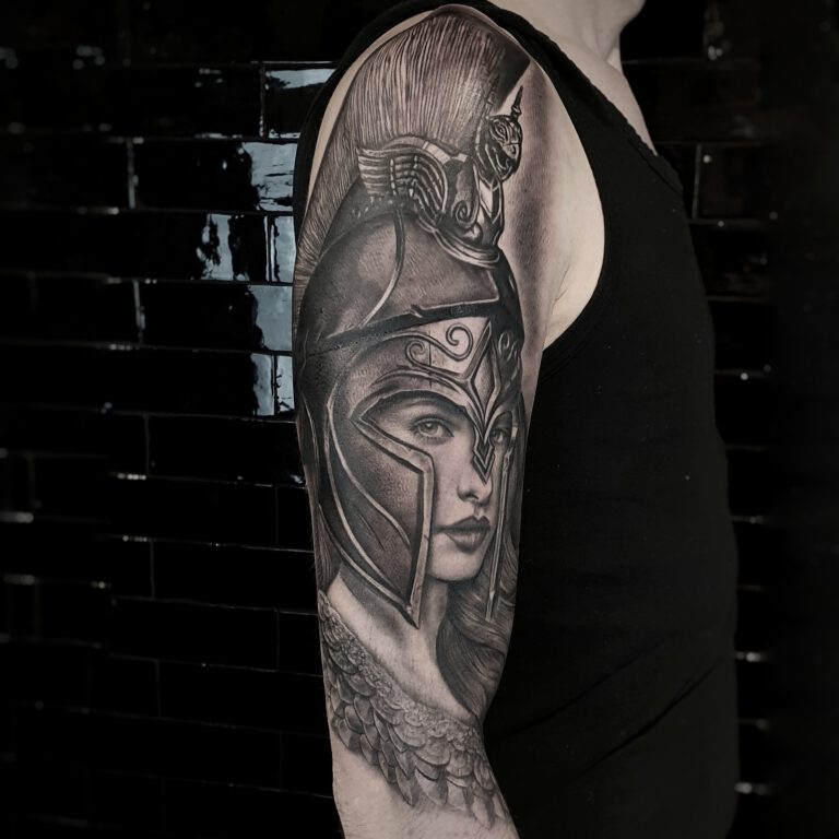 black and grey realistic athena portrait tattoo by marloes lupker