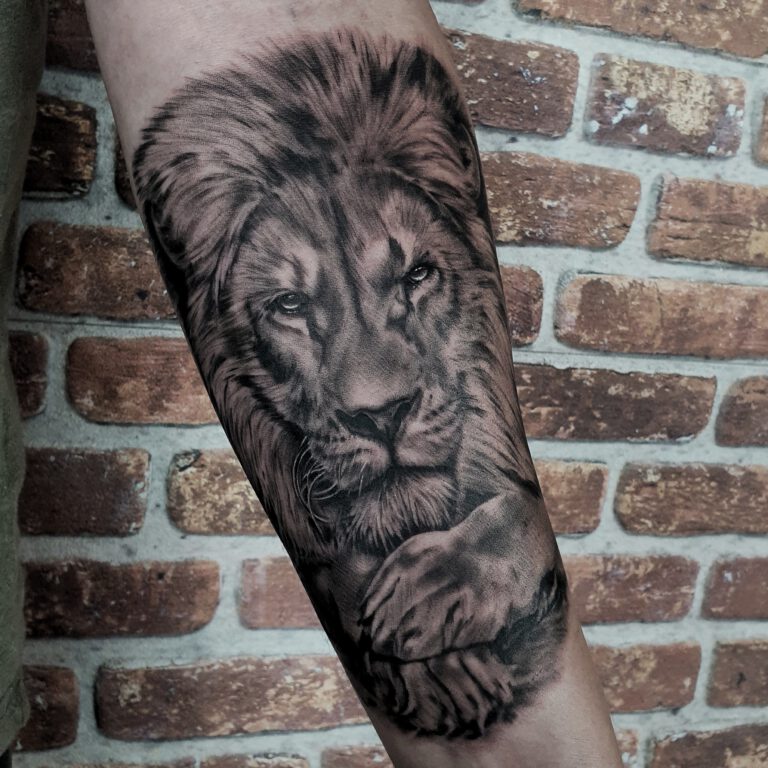black and grey realistic lion tattoo by marloes lupker