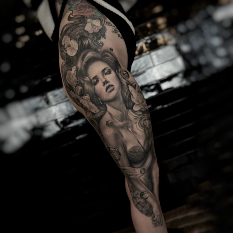 black and grey realistic ariel the mermaid tattoo by marloes lupker