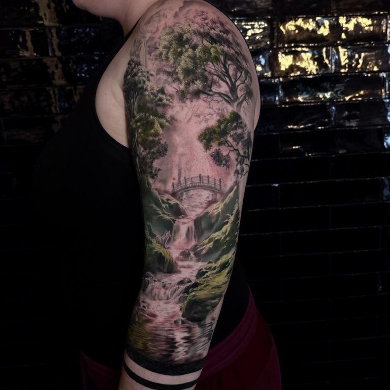 realistic forest landscape tattoo by marloes lupker