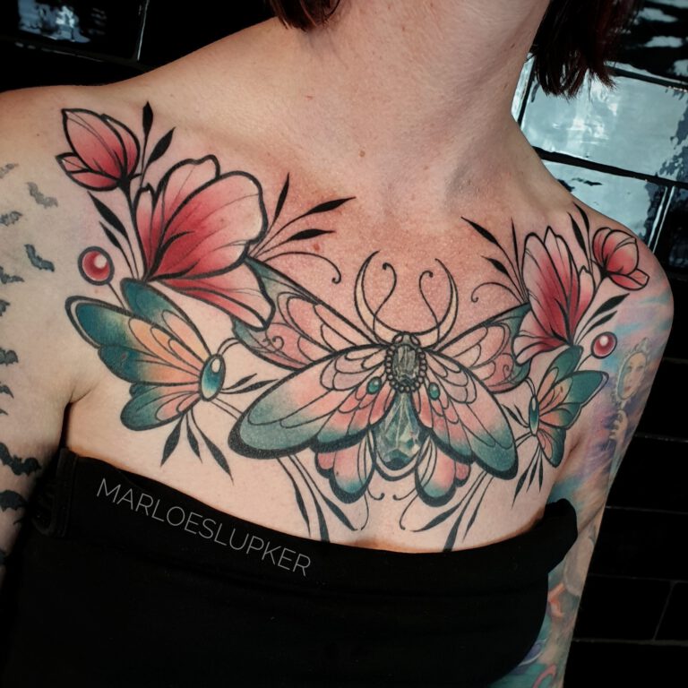 neotraditional chest piece with moths and flowers in color tattoo by marloes lupker