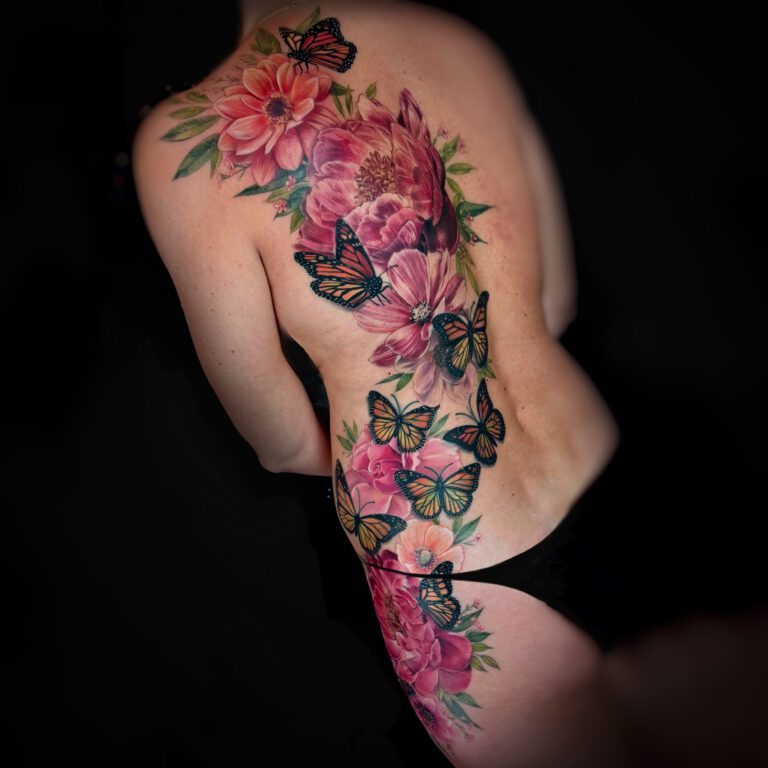 monarch butterfly and realistic pink flowers and floral body tattoo by marloes lupker