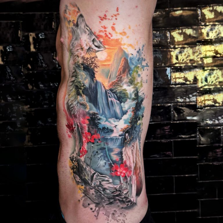 colorful watercolor realistic wolf and landscape tattoo by marloes lupker